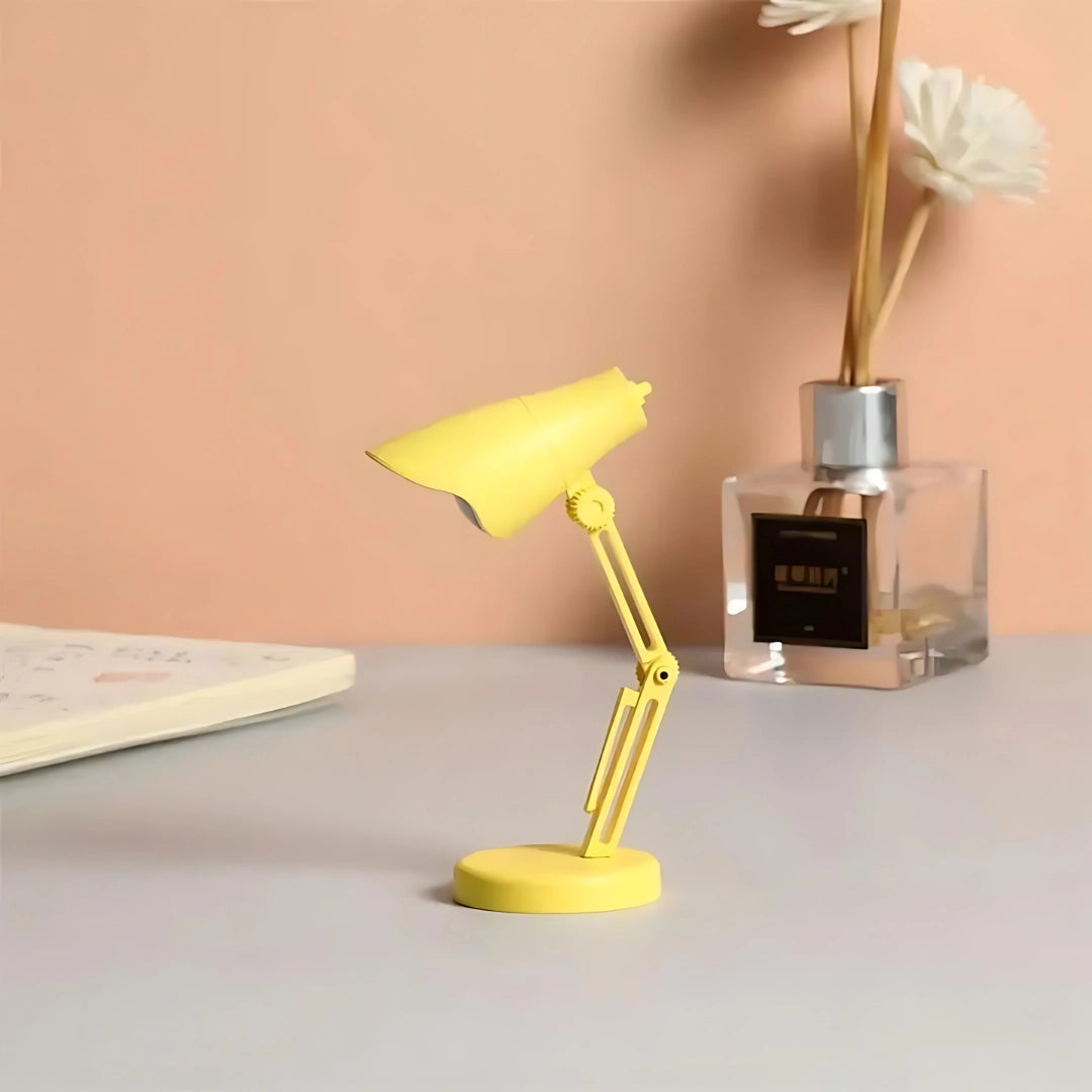 Yellow Coral Mini LED Adjustable Desk Lamp with a sleek design, featuring a stylish combination of metal and wood materials, ideal for both office and home lighting.