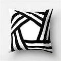 
A modern decorative pillow featuring a geometric black and white abstract design with a pattern of rectangles and triangles, measuring 60 x 60 cm.