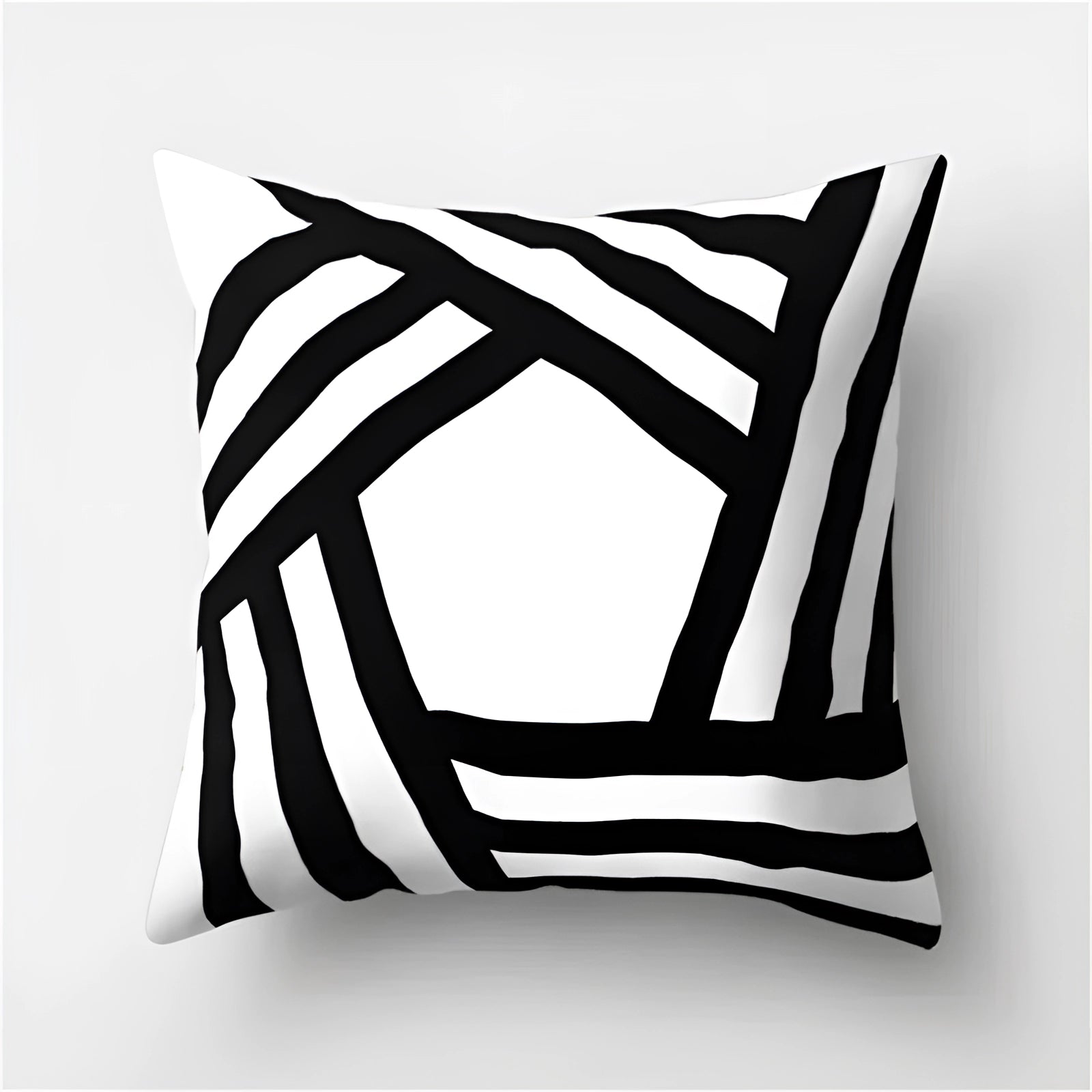 
A modern decorative pillow featuring a geometric black and white abstract design with a pattern of rectangles and triangles, measuring 60 x 60 cm.